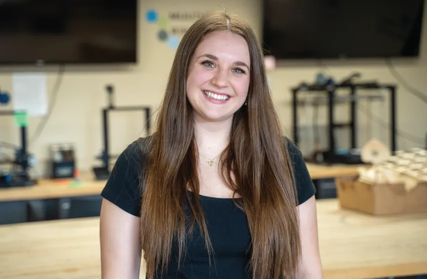 A smiling young woman.